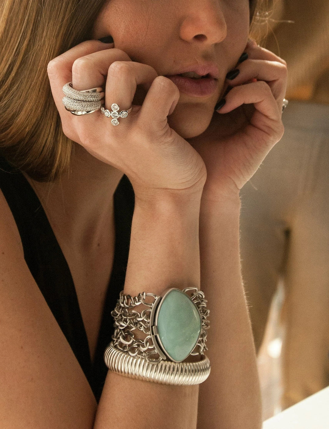 Woman wearing bracelets and rings