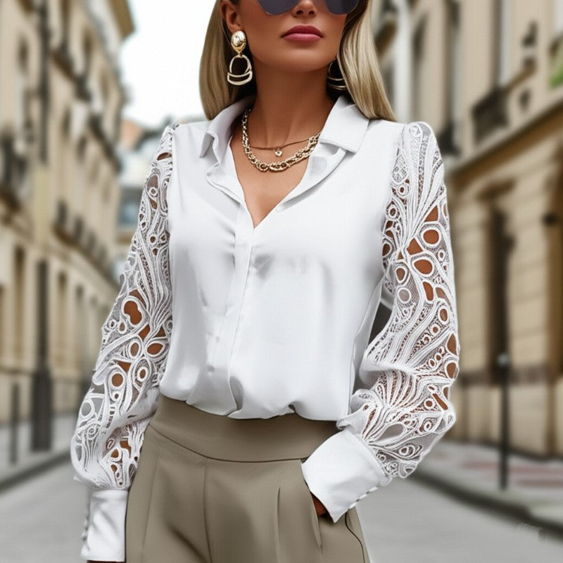 Woman wearing a white blouse with lace sleeves in an urban setting