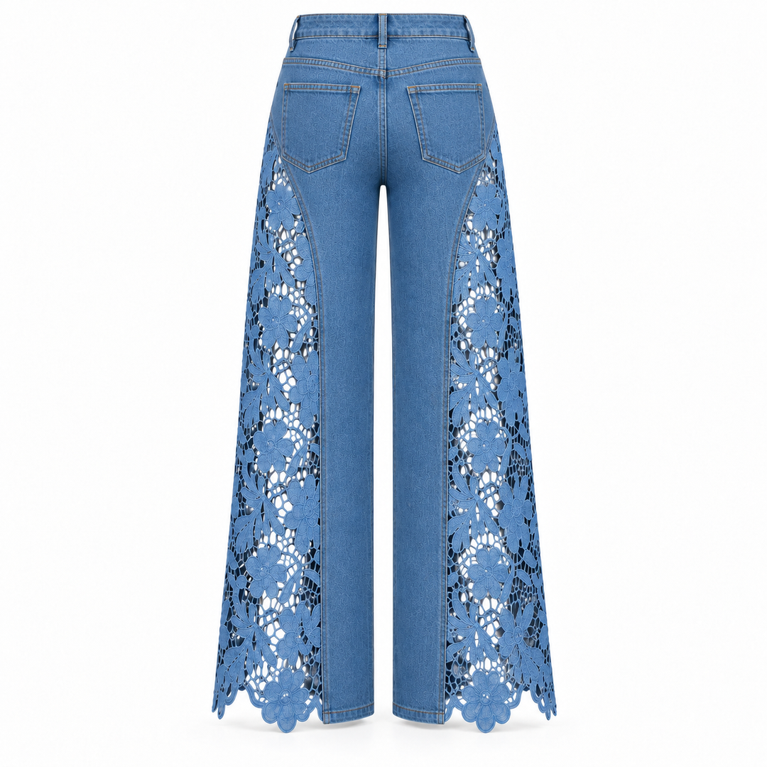 Blue wide-leg denim pants with intricate floral lace panels down the front of the legs, shown from the back on a white background.
