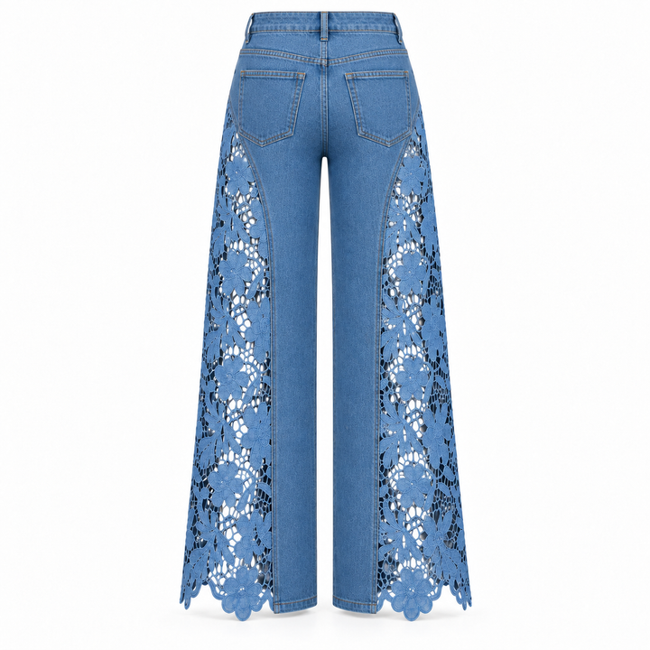Blue wide-leg denim pants with intricate floral lace panels down the front of the legs, shown from the back on a white background.