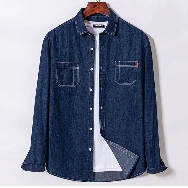 Blue denim shirt on a hanger against a white background