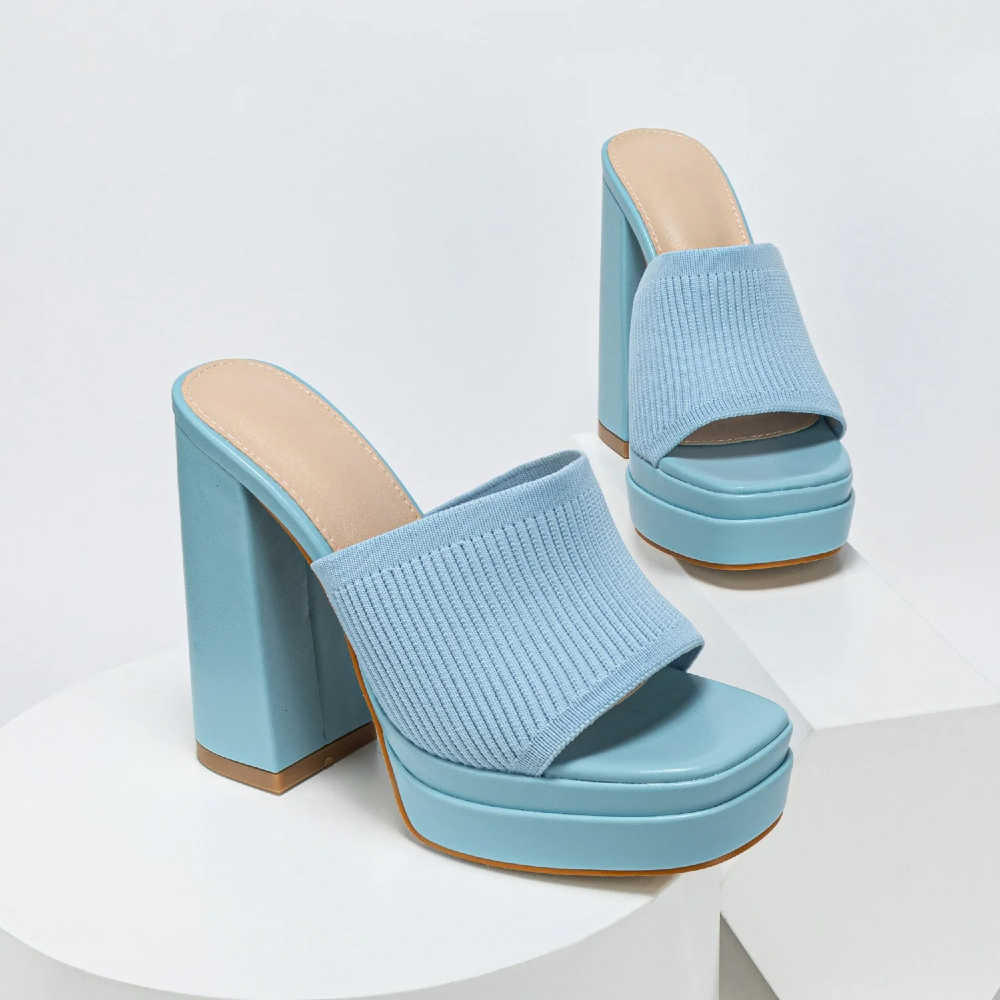 Light blue platform sandals on a white background