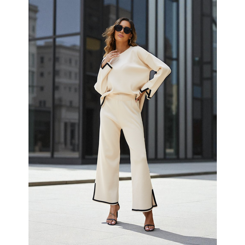 Woman in a beige outfit standing in an urban setting