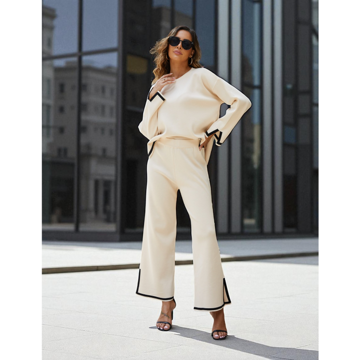 Woman in a beige outfit standing in an urban setting