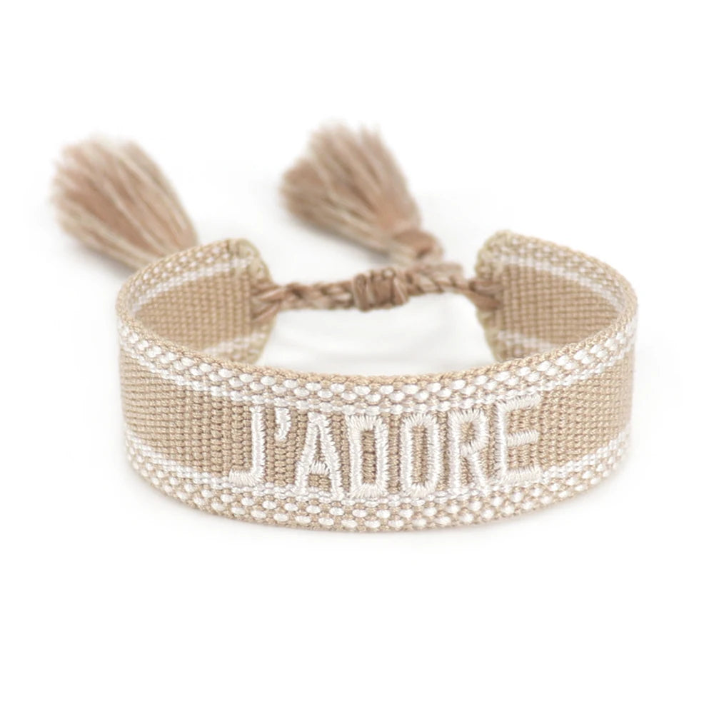Beige bracelet with tassels and 'I'padore' text on a white background