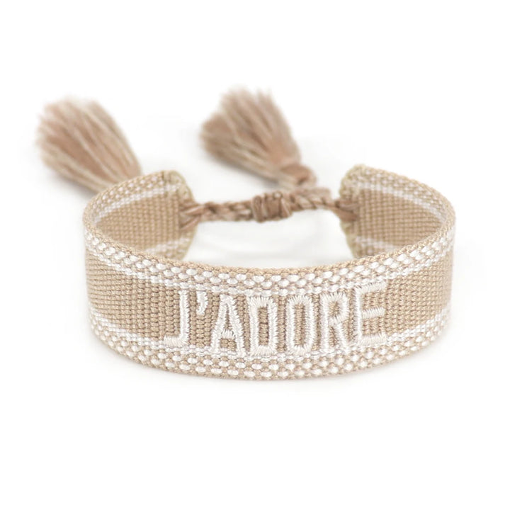 Beige bracelet with tassels and 'I'padore' text on a white background