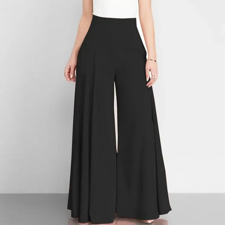 Black wide-leg pants worn by a person on a plain background