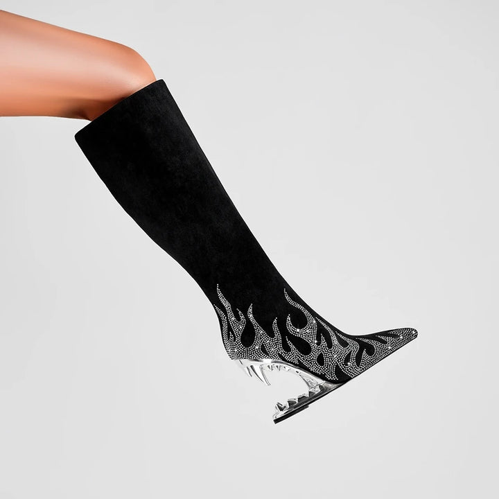 Black knee-high boot with flame design and high heel on a light gray background