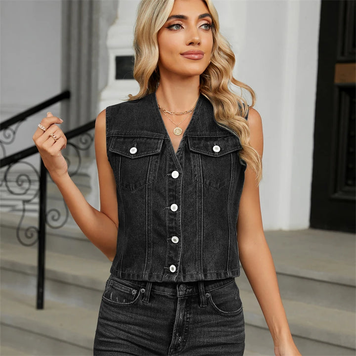 Woman wearing a black denim vest outdoors