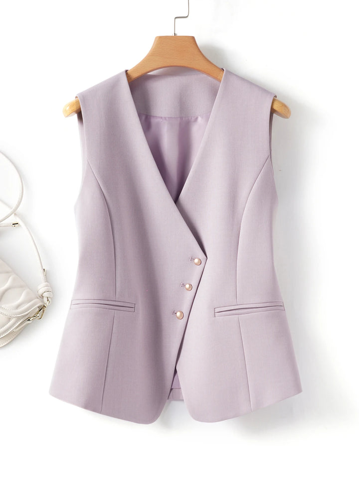 Light purple vest on a wooden hanger against a white background