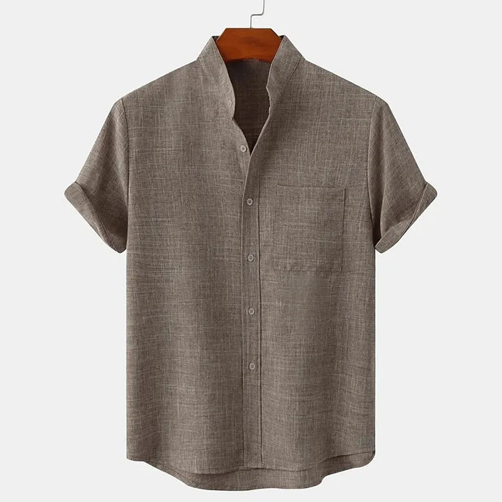 Brown short-sleeve shirt on a hanger with a white background