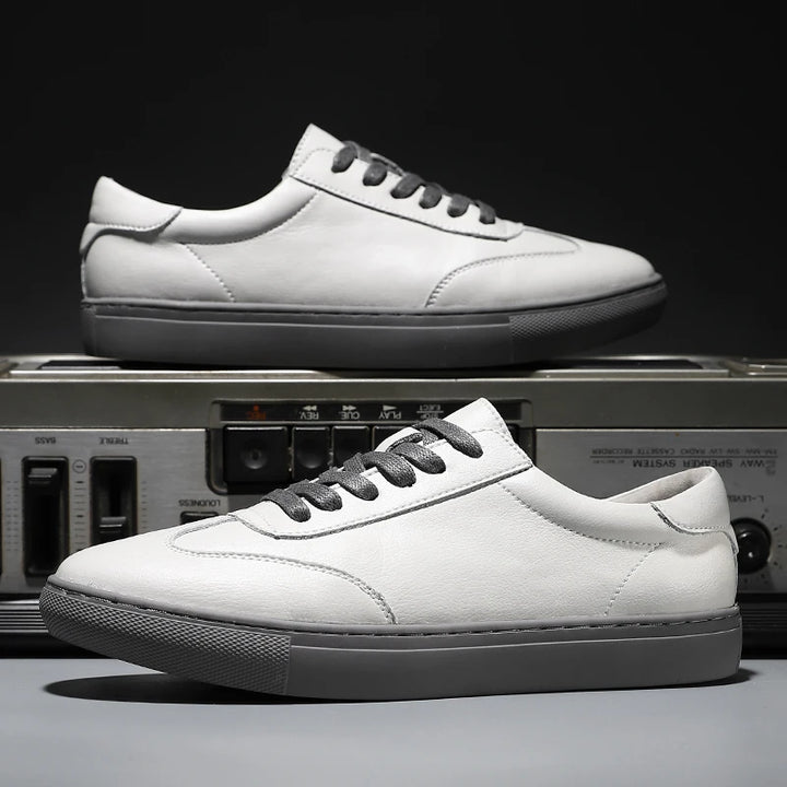 White sneakers with gray accents on a vintage radio background