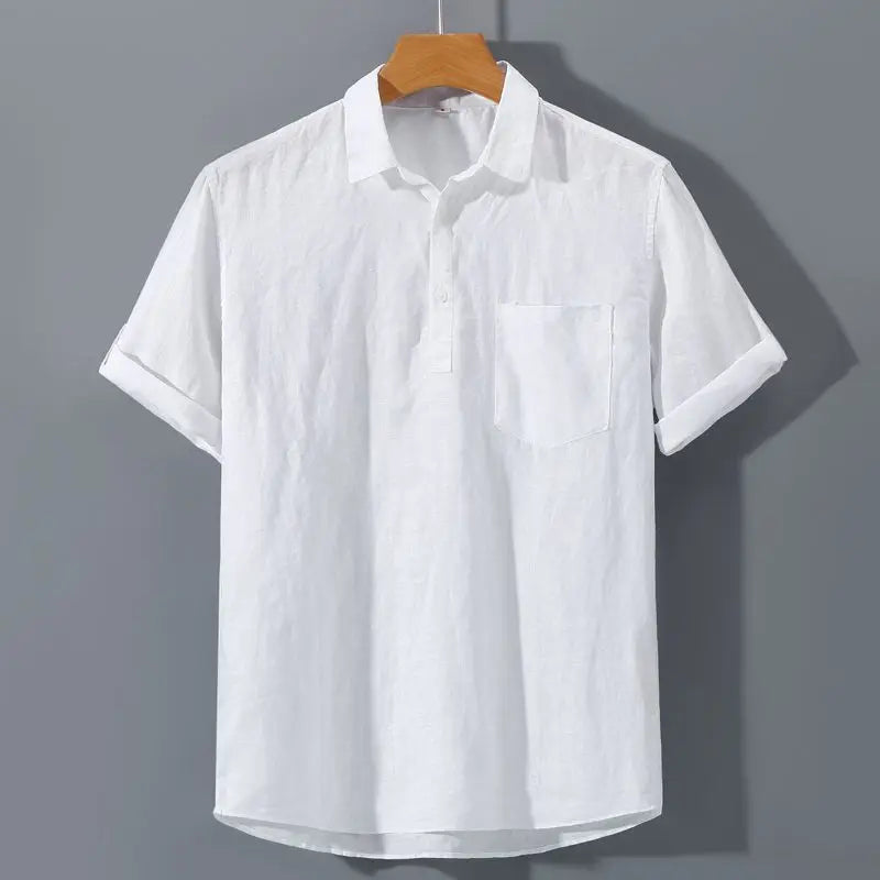 White short-sleeve shirt on a hanger against a gray background