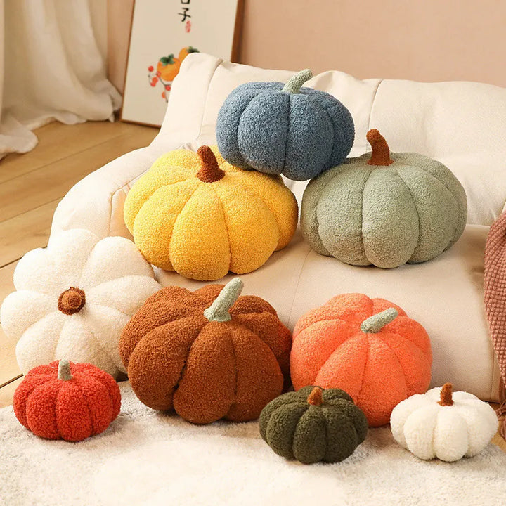 Colorful pumpkin-shaped cushions on a sofa