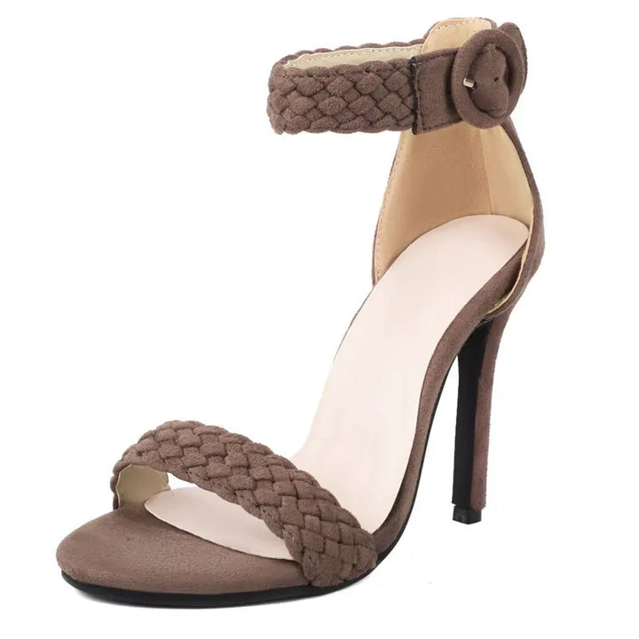 Brown high-heeled sandal with braided design on a white background