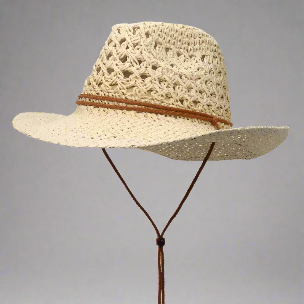 Beige straw hat with a brown band on a white background