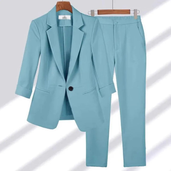 Light blue suit jacket and pants on a white background