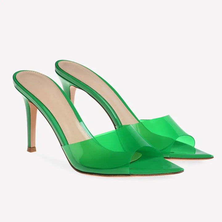 Green high-heeled shoes on a white background