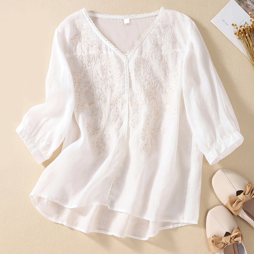 White lace blouse on a beige background