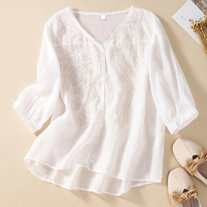 White lace blouse on a beige background