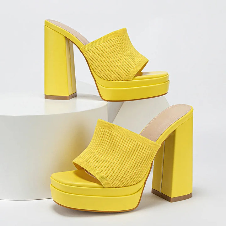 Yellow platform sandals on a white background