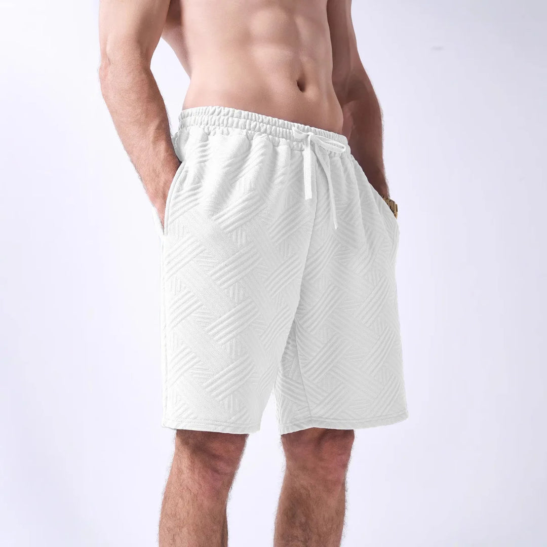 White shorts worn by a person on a white background