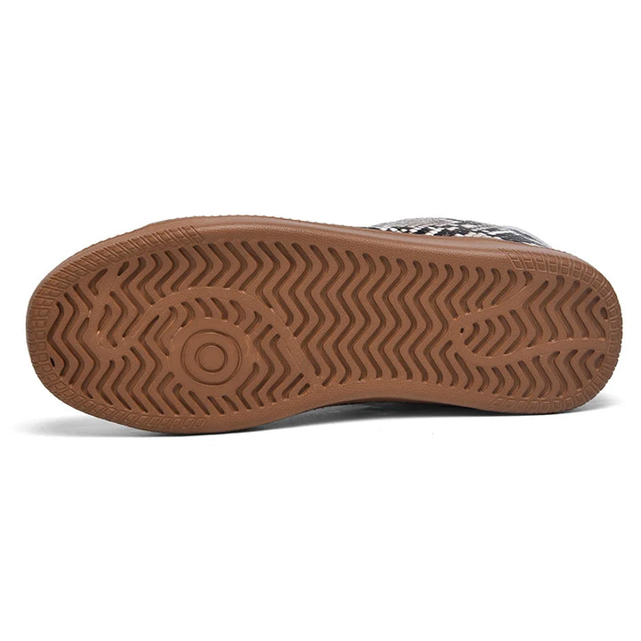 Brown sole of a shoe on a white background