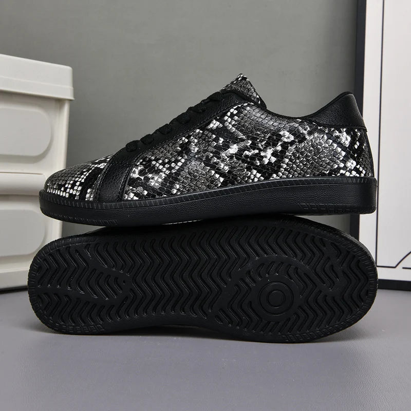 Black sequin sneakers on a gray background