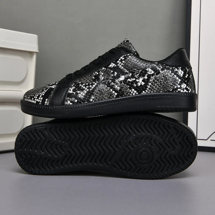 Black sequin sneakers on a gray background