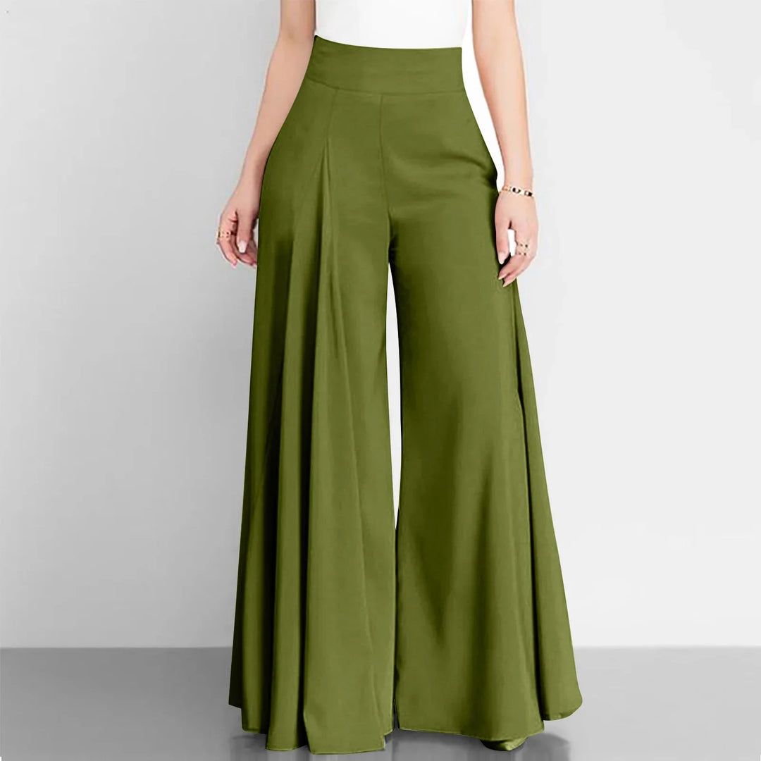 Green wide-leg pants worn by a person on a gray background