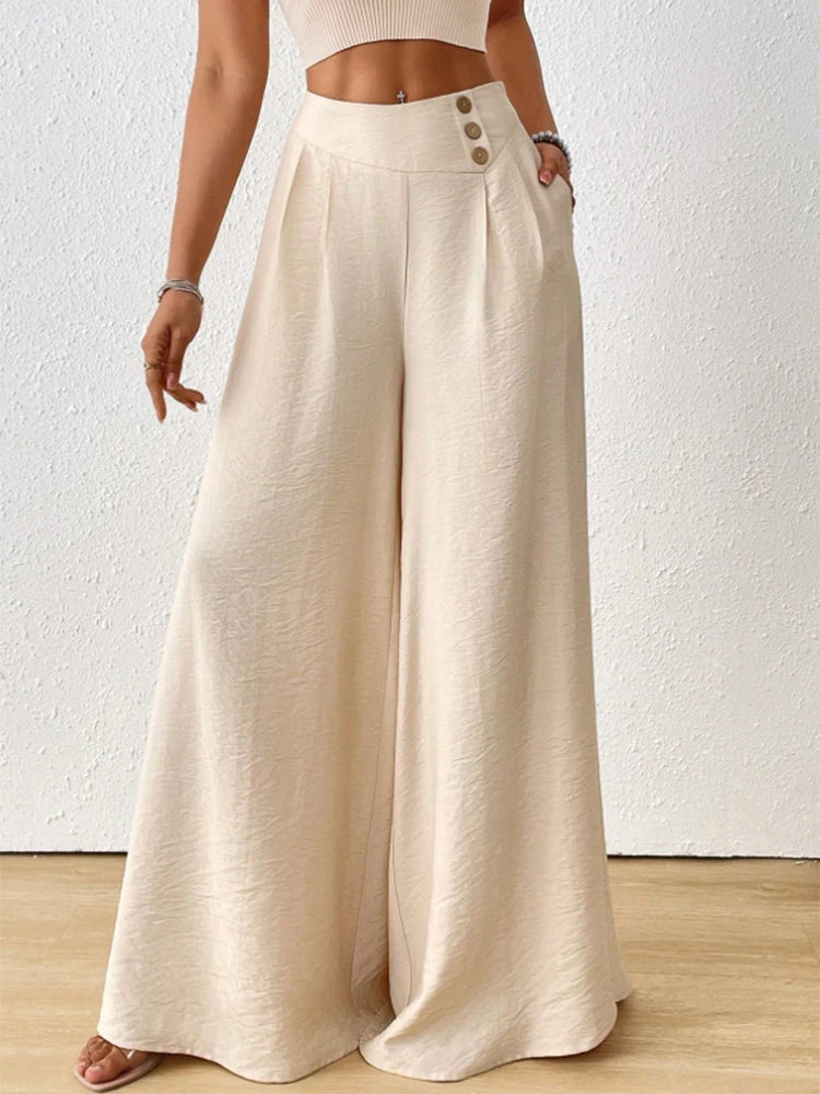 Beige wide-leg pants worn by a person on a white background