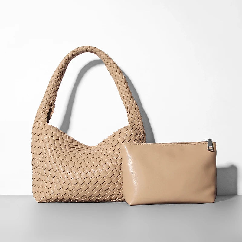 Beige woven handbag and matching pouch on a light gray background