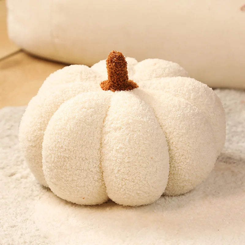White pumpkin with a brown stem on a textured surface