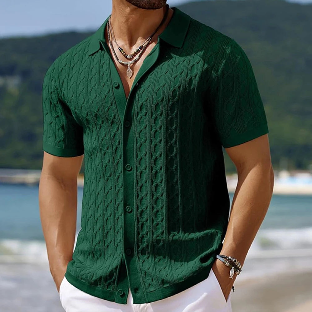 Man wearing a green textured shirt with a blurred natural background