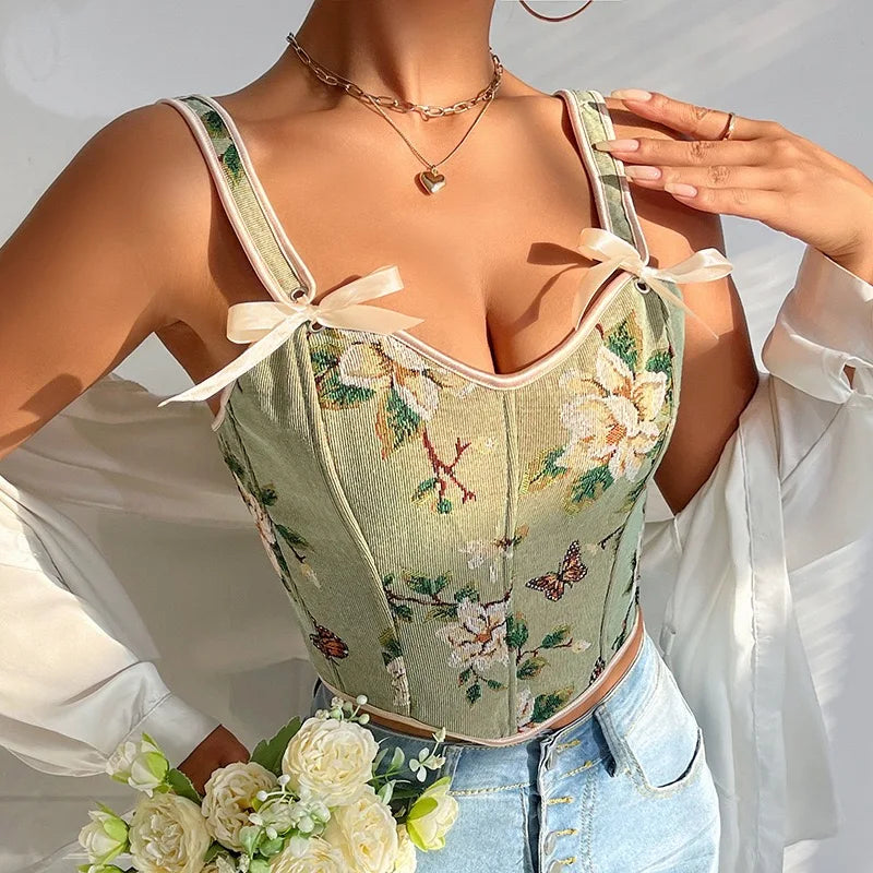 Floral embroidered corset worn by a model with a blurred background