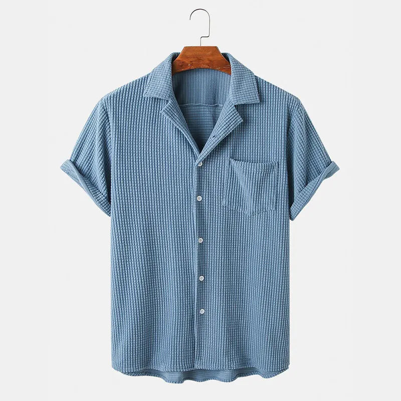Blue checkered shirt on a hanger against a white background