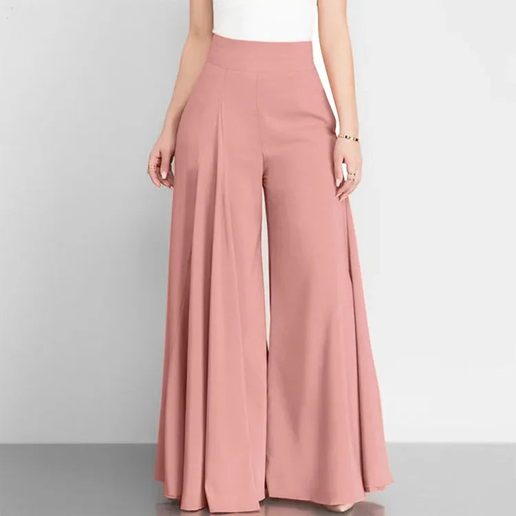 Pink wide-leg pants worn by a person on a light gray background