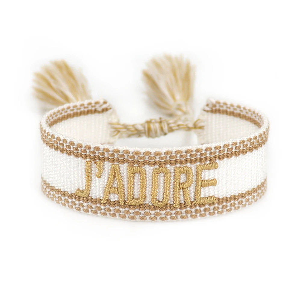 Bracelet with 'J'adore' text on a white background
