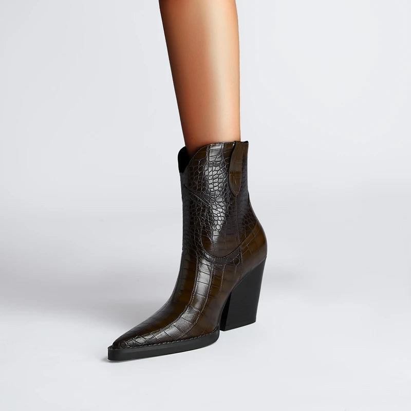 Brown crocodile-patterned ankle boot on a light gray background