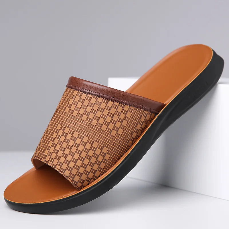 Brown slide sandal with woven pattern on a white background