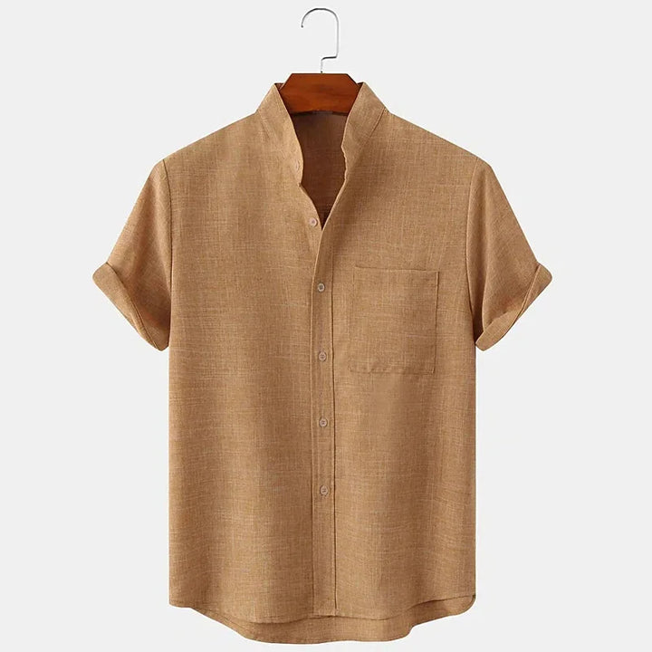 Beige short-sleeve shirt on a hanger against a white background