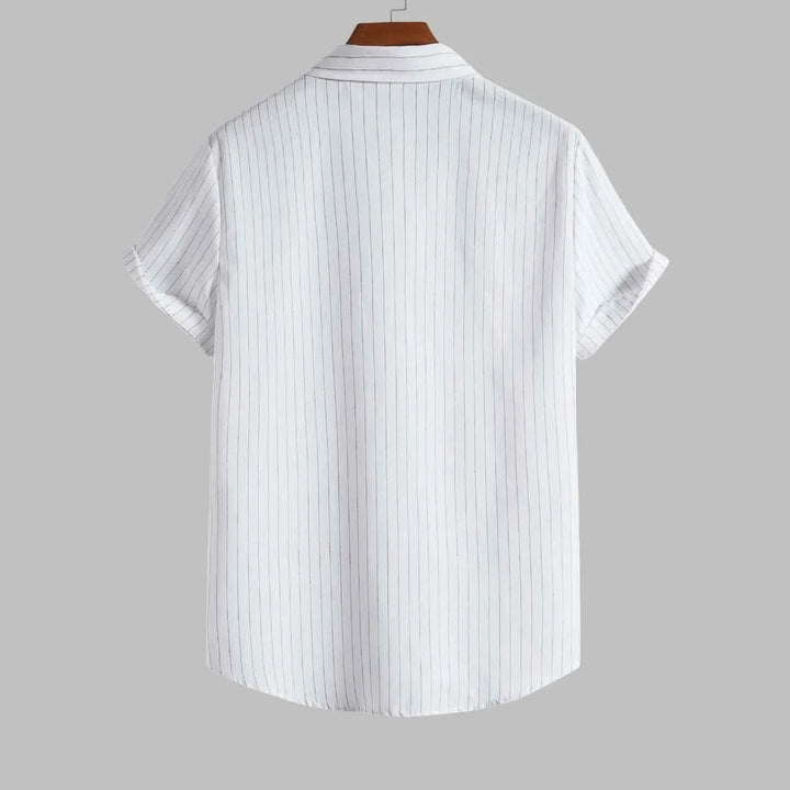 White short-sleeve shirt with thin blue stripes on a gray background