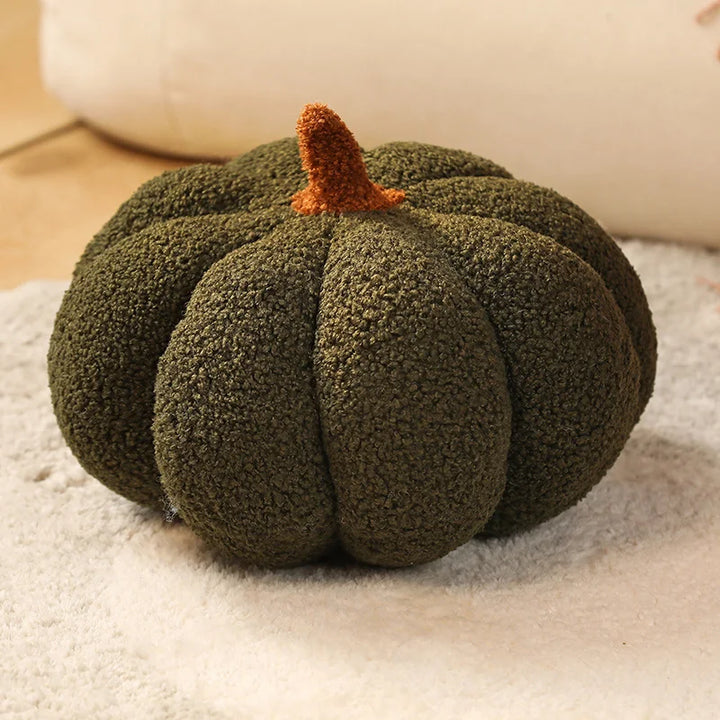 Green textured pumpkin on a light surface