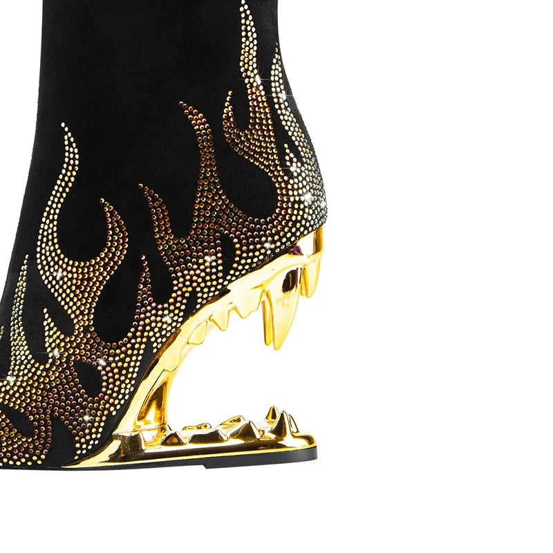 Black shoe with gold flame design and heel on a white background
