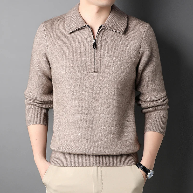 Beige sweater with a quarter zip on a gray background