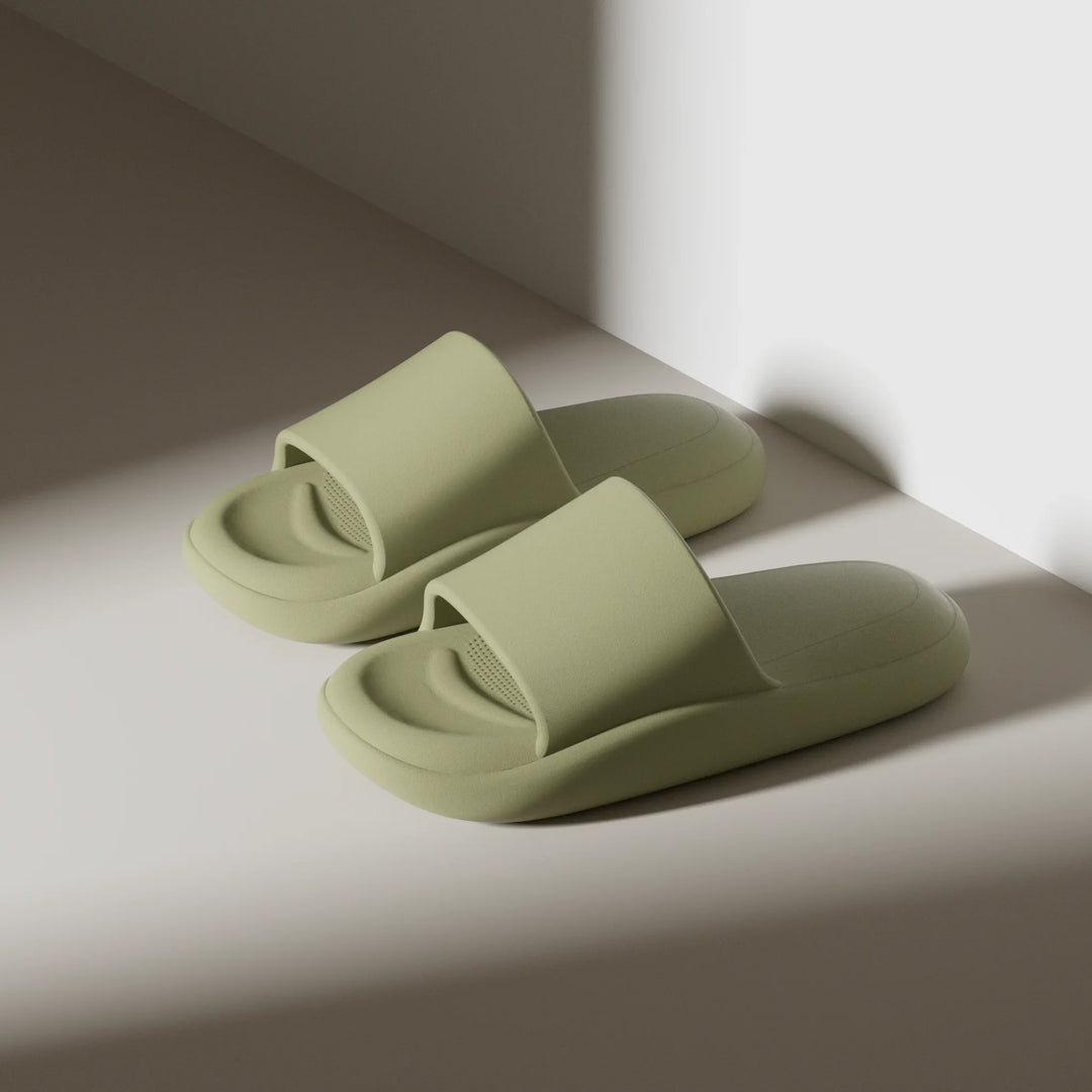 Pair of light green slides on a neutral background