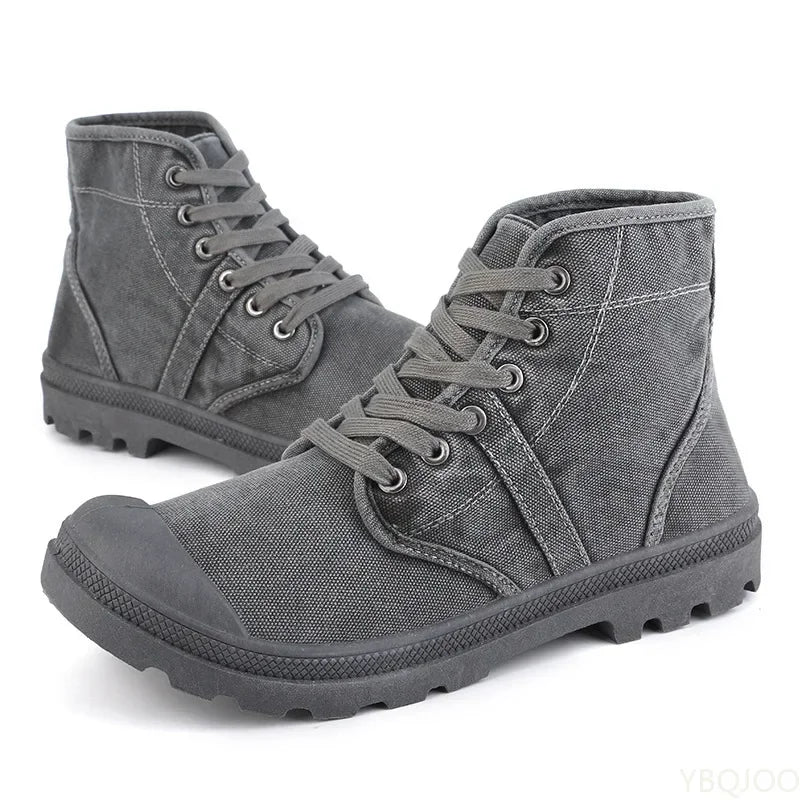 Pair of gray high-top sneakers on a white background