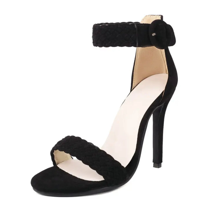Black high-heeled sandal with braided design on a white background