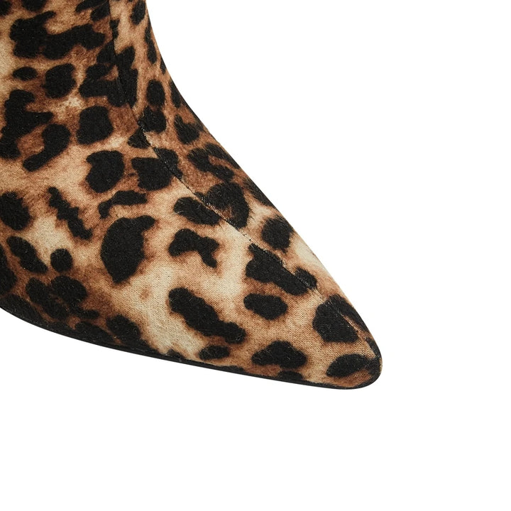 Close-up of a leopard print shoe heel on a white background