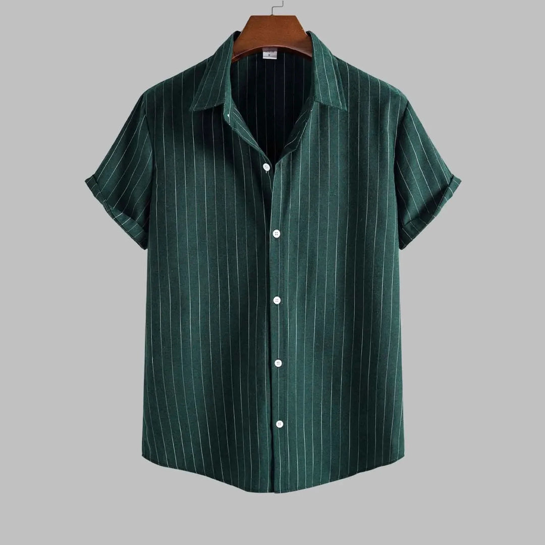 Green striped shirt on a hanger against a gray background